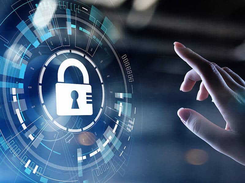 A hand reaches toward a digital interface displaying a padlock icon, symbolizing cybersecurity or data protection.
