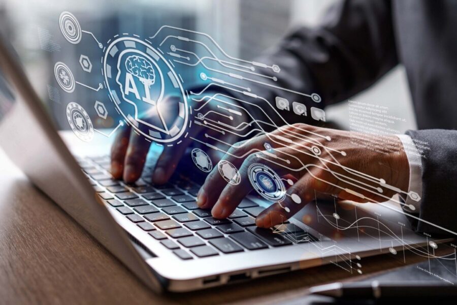Person typing on a laptop with digital graphics of AI and technology icons overlaying the image, symbolizing artificial intelligence and data processing.